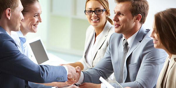 Businessmen shaking hands at a meeting
